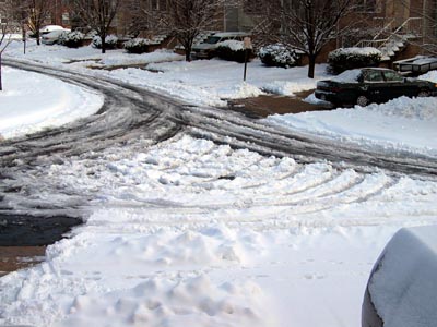 Tire tracks in the snow that look like a Christmas Tree
